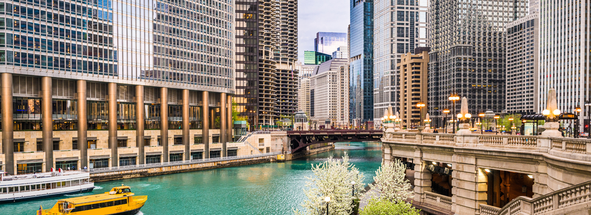 Image of downtown skyscrapers along The Chicago River on a sunny day