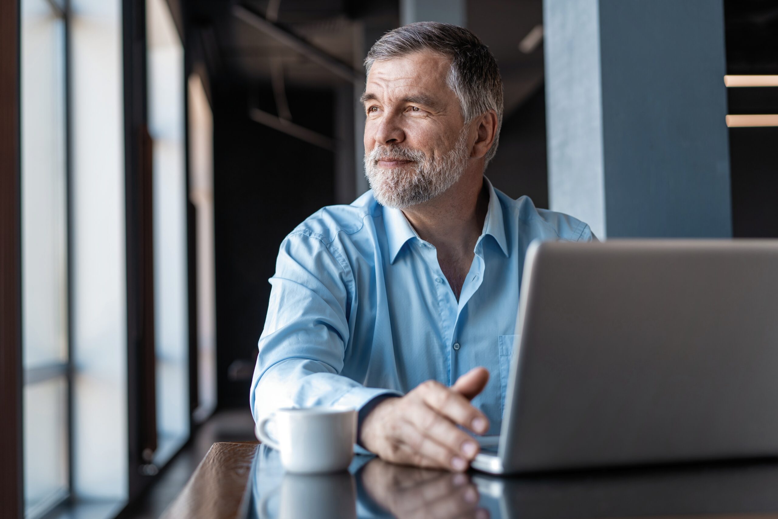 Small business owner reviewing LLC records and Annual Report filing documents to maintain clear separation between personal and business activity.